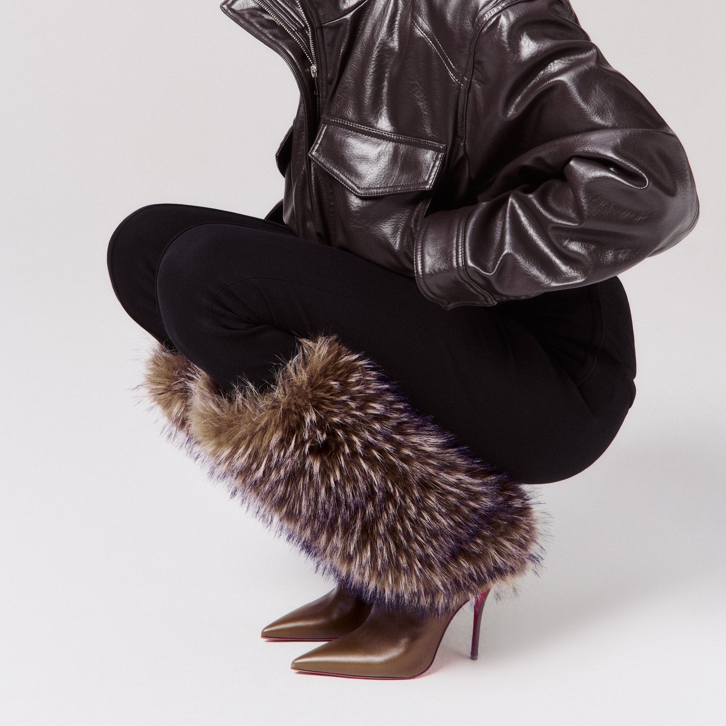 Pointed-toe stiletto heeled faux fur boots