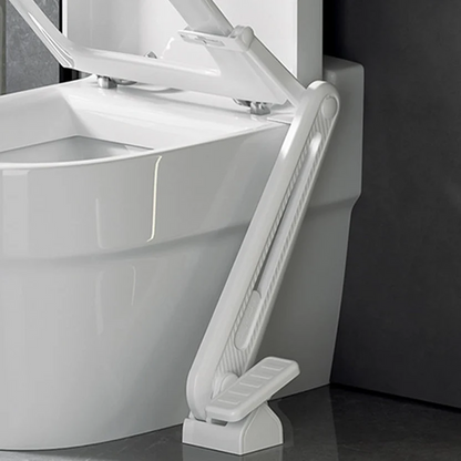 Foot-operated toilet seat lifter